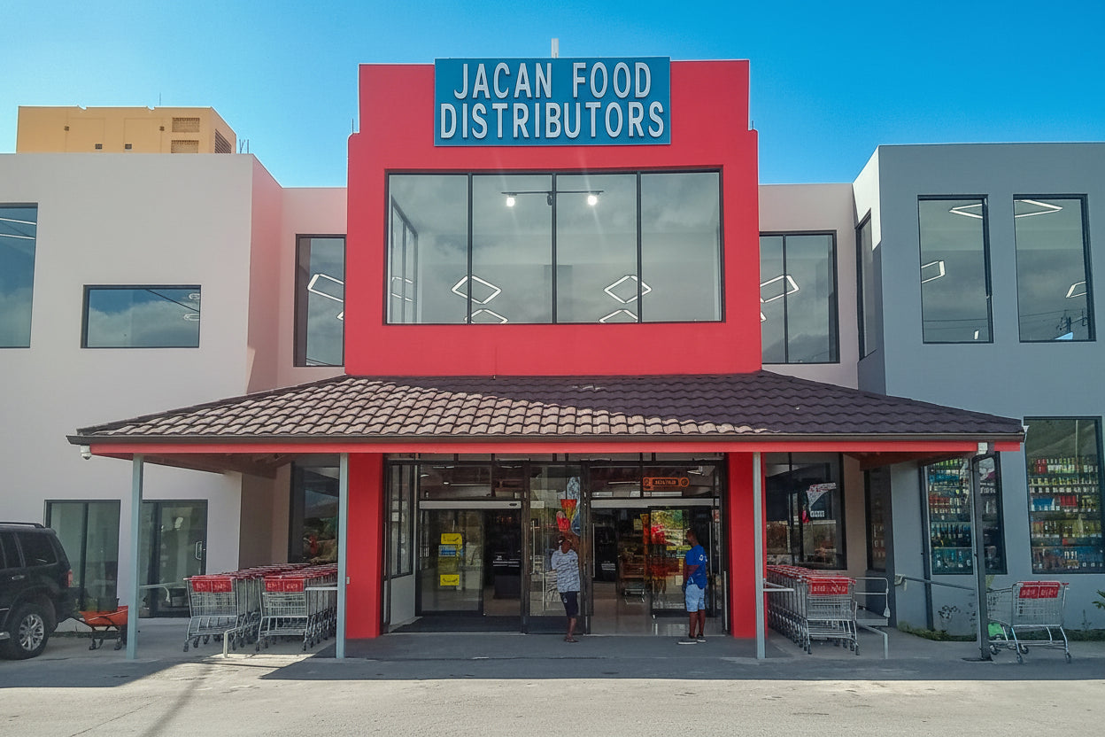 JACAN Food Distributors store front with a red and white facade.
